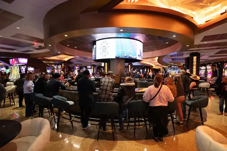 People socializing at a lively casino bar