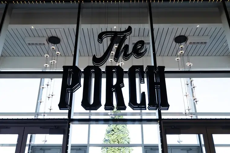 The Porch sign above entrance with glass ceiling