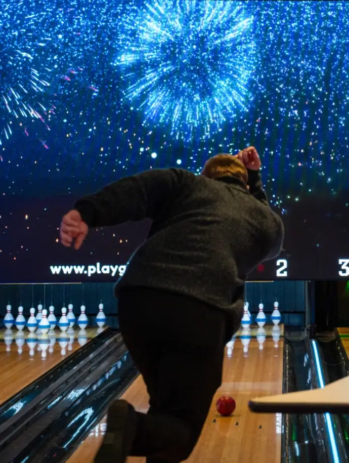 Person bowling on an indoor lane