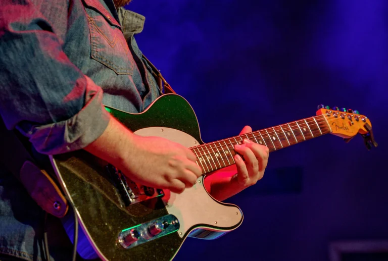 man playing a Fender guitar at Gilley's